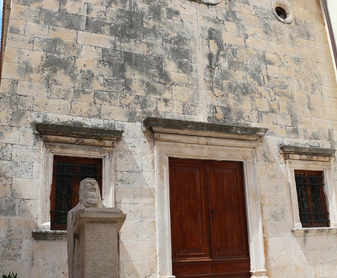 The Benedictine church of St Anthony in Hvar Town — limestone facade and a quiet square