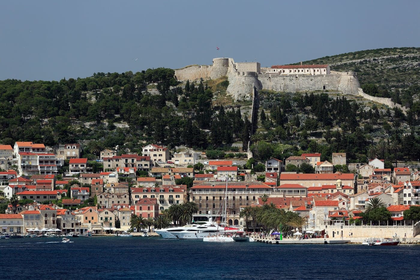 The Fortica above Hvar Town — stone walls, red roofs and the harbour below