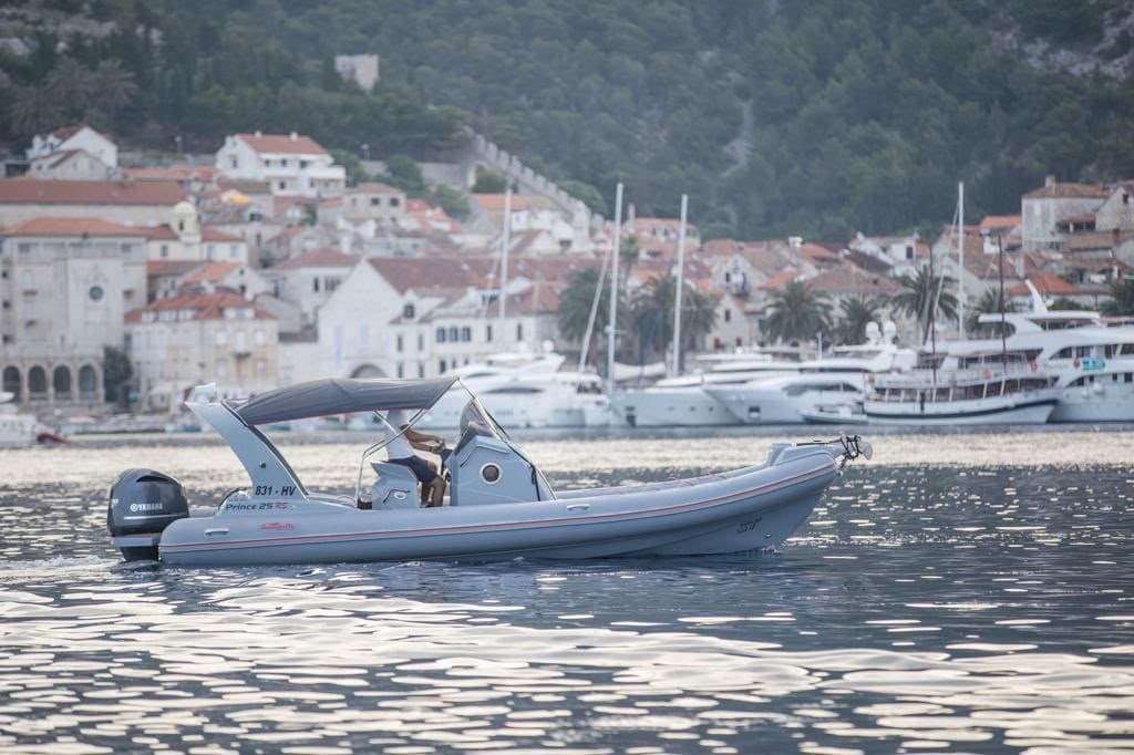 The Prince 25 RIB passing the old town and the yacht quay