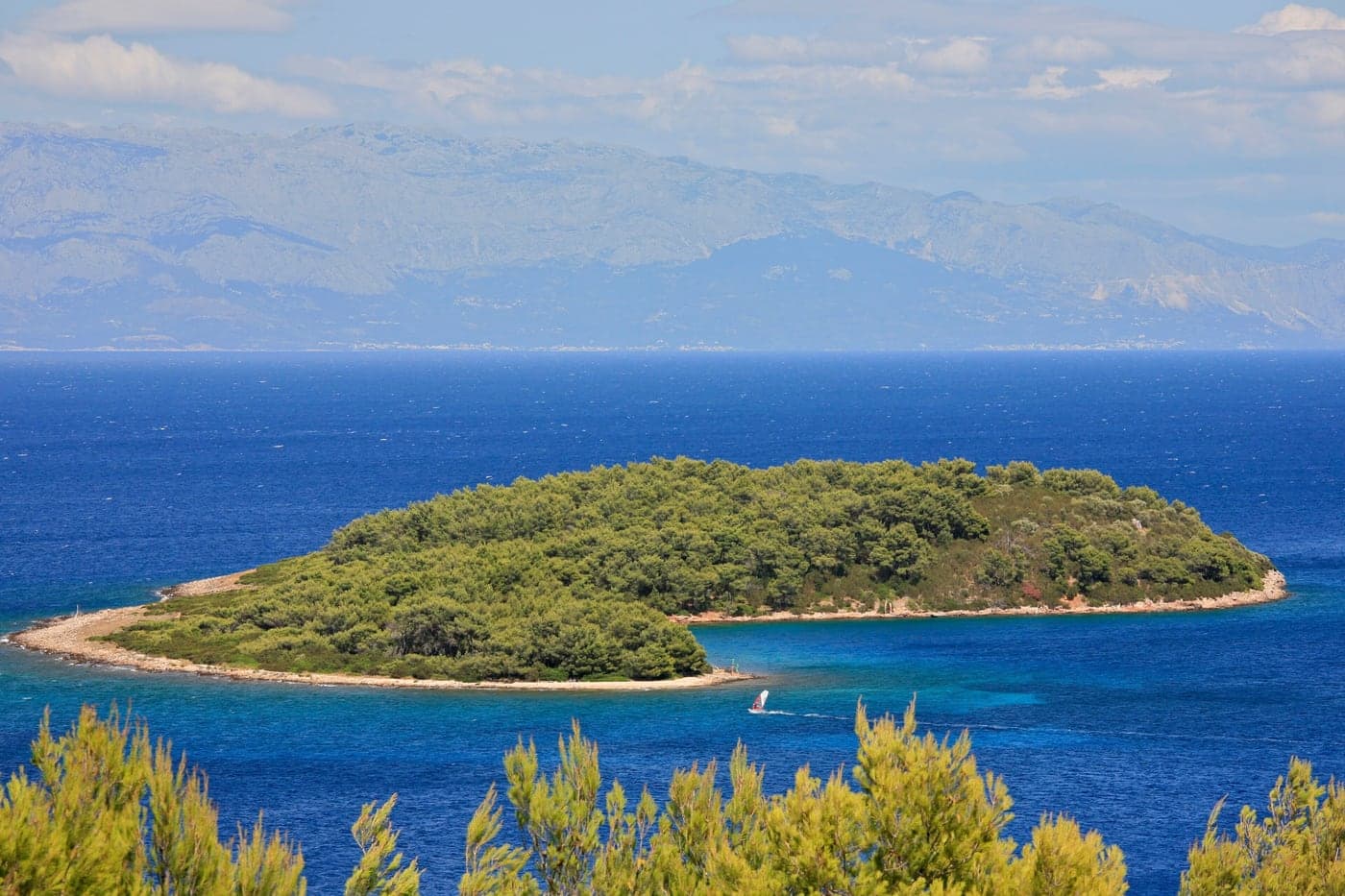 Zečevo islet off the Soline peninsula near Vrboska — pines in turquoise water